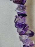 Close view of the polished Amethyst chips on the bracelet