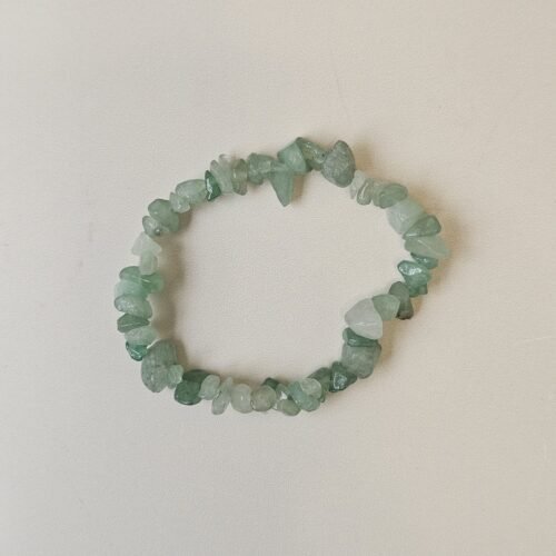 Green Aventurine crystal bracelet with polished green chips on a cream background