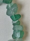 Close view of the polished Green Aventurine chips on the bracelet