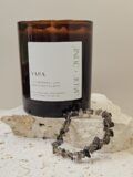 Smoky Quartz crystal bracelet on travertine beside the Yara candle