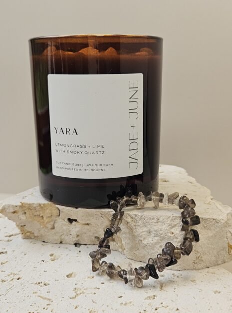 smoky-quartz-bracelet-02 Smoky Quartz crystal bracelet on travertine beside the Yara candle