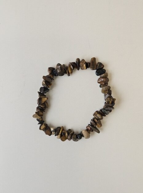 tigers-eye-bracelet-01 Tiger's Eye crystal bracelet with polished gold and brown chips on a cream background
