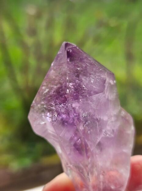 Amethyst Rough Point 6 Rough Amethyst point held from the base, full piece in frame