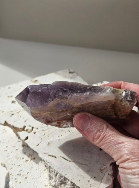 Bahia Amethyst 7 Bahia Amethyst point held in the hand, showing its size