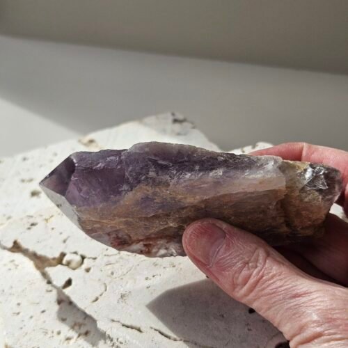Bahia Amethyst 7 Bahia Amethyst point held in the hand, showing its size