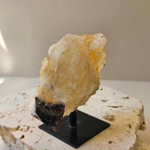Citrine cluster on its stand, turned to a three quarter angle