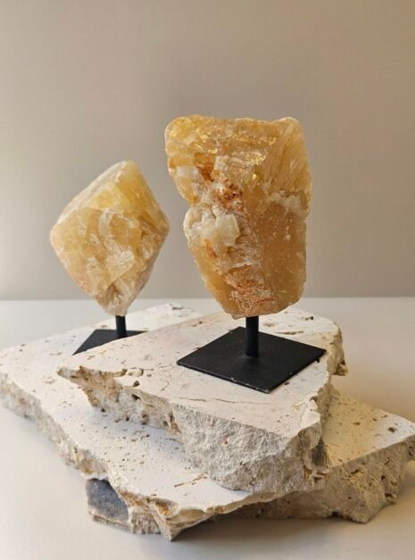 Citrine On Black Stand 1 Two rough Citrine pieces on their stands at different heights