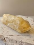 Bahia Citrine point in side profile showing its full length
