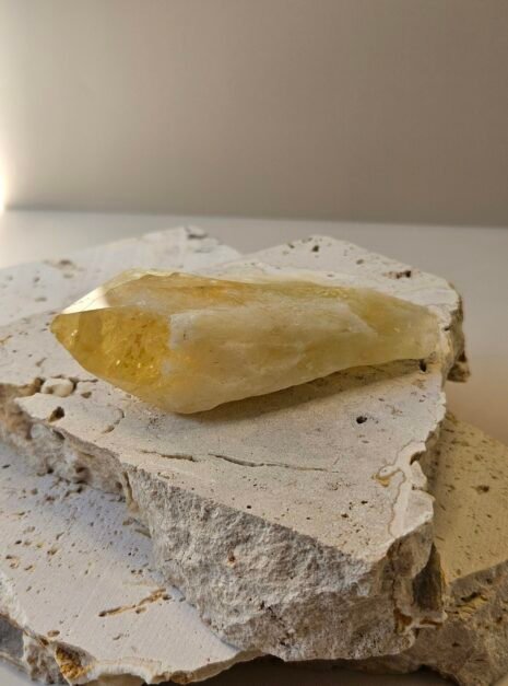 Citrine Point Bahia 4 Bahia Citrine point on a cream surface, front facing
