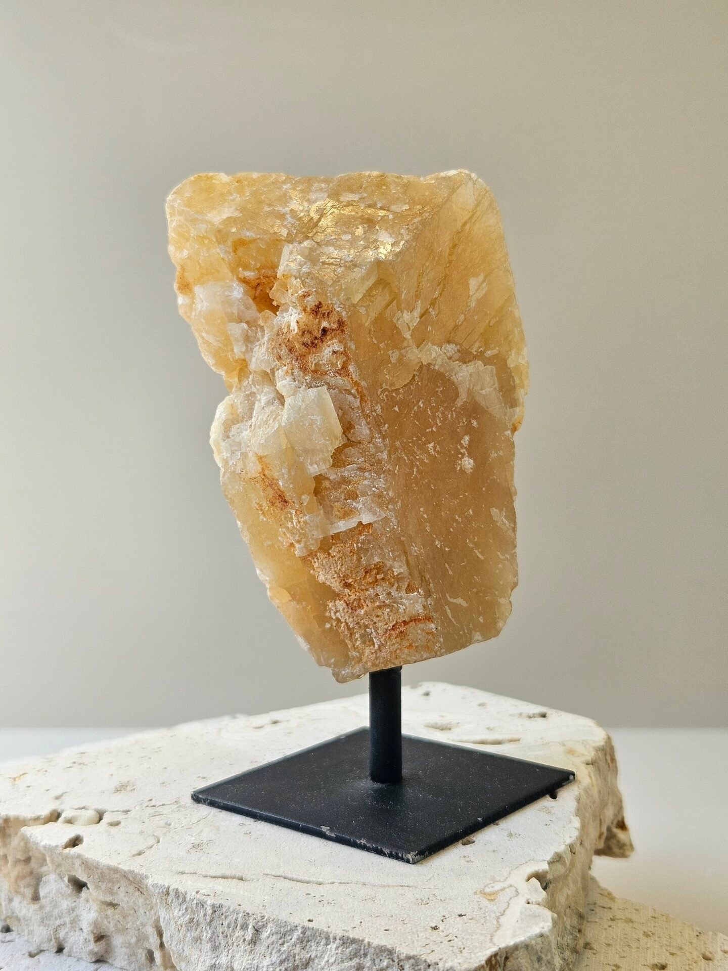 Citrine on Black Stand 2 Rough Citrine on a black metal stand, front facing
