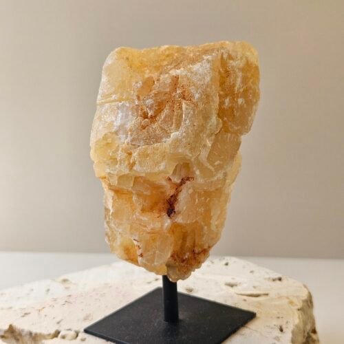 Citrine on Black Stand 3 Rough Citrine on its stand, turned to a three quarter angle