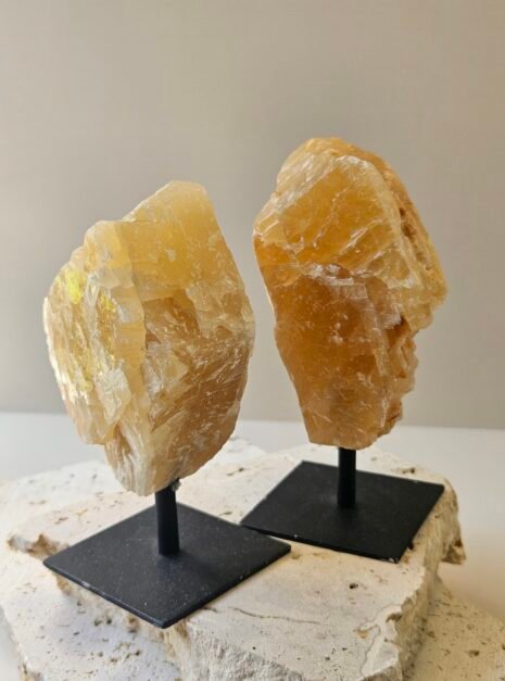 Citrine on Black Stand 6 Two rough Citrine pieces of similar size and colour on their stands, angled apart