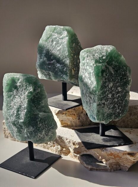 Green Aventurine Rough on Stand 3 Three rough Green Aventurine pieces on their stands, angled together