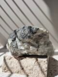 Rainbow Moonstone freeform standing upright, front on, polished soft white stone