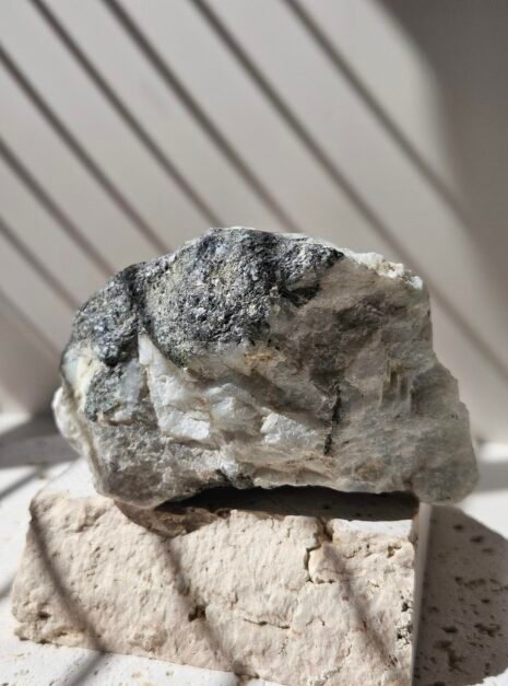 Rainbow Moonstone freeform standing upright, front on, polished soft white stone