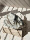 Rainbow Moonstone freeform in natural light, showing the dark inclusion in the stone