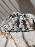 Three Rainbow Moonstone bracelets together, showing how the beads vary between them