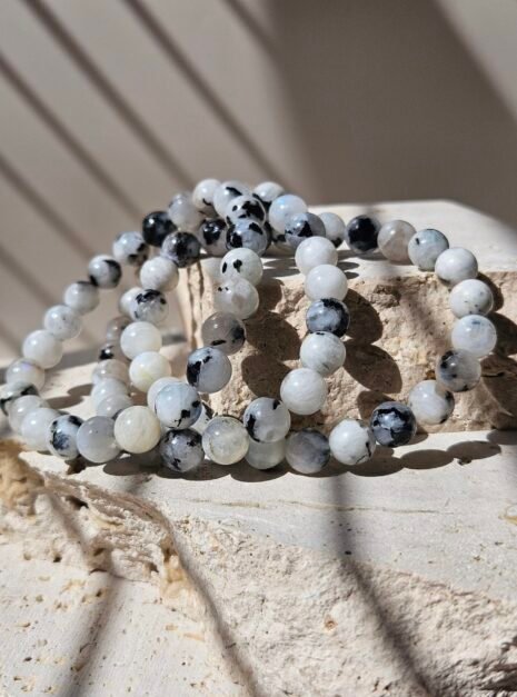 Rainbow Moonstone Bracelet 1 Three Rainbow Moonstone bracelets together, showing how the beads vary between them