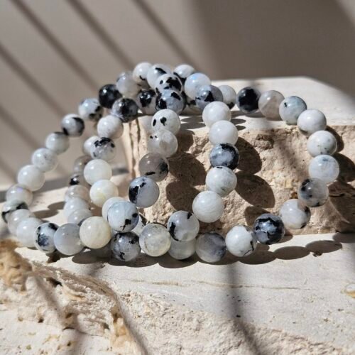 Rainbow Moonstone Bracelet 1 Three Rainbow Moonstone bracelets together, showing how the beads vary between them