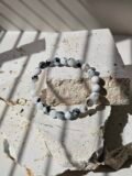 A single Rainbow Moonstone bracelet on stretch cord