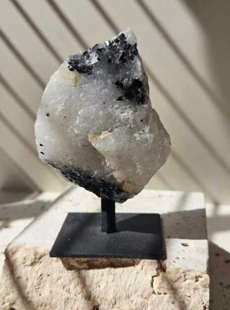 Rough Moonstone 2 Rough Rainbow Moonstone on its stand, turned to a three quarter angle