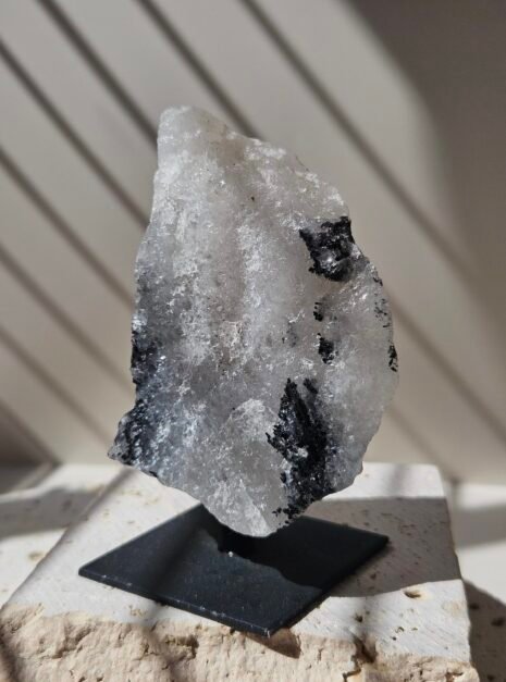 Rough Moonstone 4 Rough Rainbow Moonstone on its stand, showing a wide triangular face