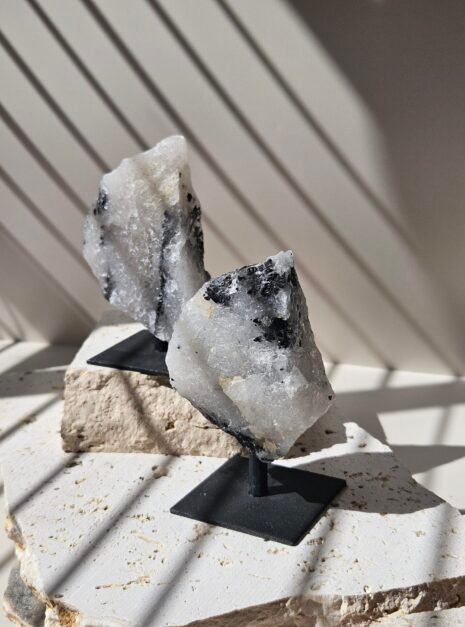Rough Moonstone Two rough Rainbow Moonstone pieces side by side on their stands, showing how the shapes vary