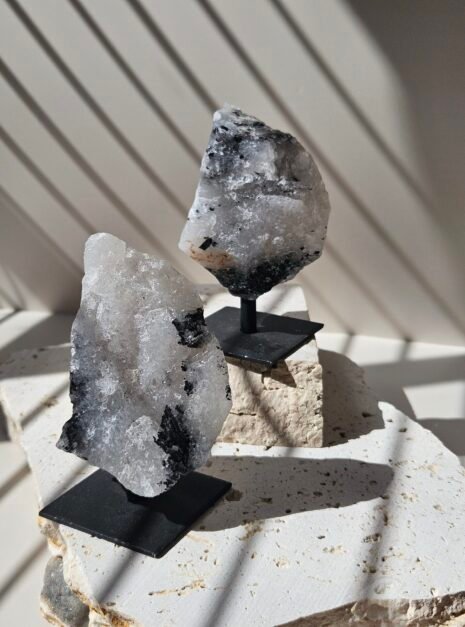Rough Moonstone hero Two rough Rainbow Moonstone pieces on their stands at different heights